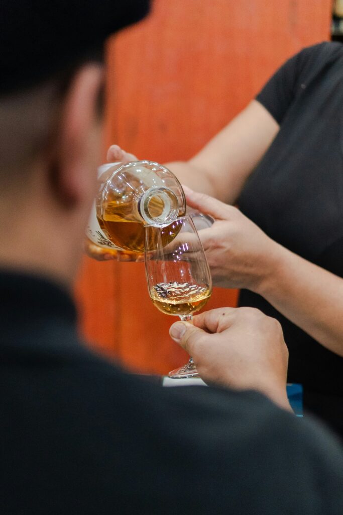 Single oak cask in maturation warehouse Stenciled whisky cask with distillery markings Aged Scotch whisky cask ready for investment
