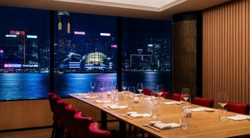 Elegant private dining room in Hong Kong set for Lunar New Year celebration with rare whisky cask release and exclusive family office networking event.