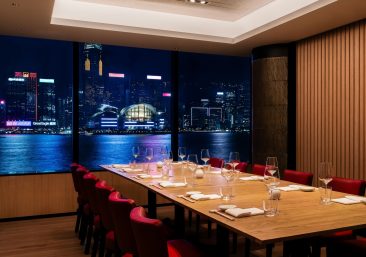 Elegant private dining room in Hong Kong set for Lunar New Year celebration with rare whisky cask release and exclusive family office networking event.