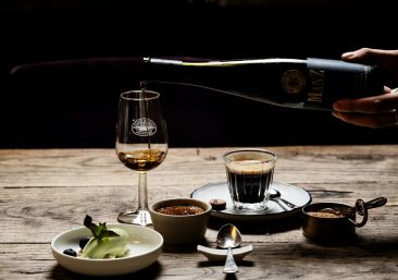 Regal Cask's three whisky investment tiers: Blue-Chip Core with gold cask and stability chart; Growth Portfolios showing green upward arrow; Club-Exclusive featuring premium tasting glass—all against elegant dark oak whisky warehouse texture with golden lighting.